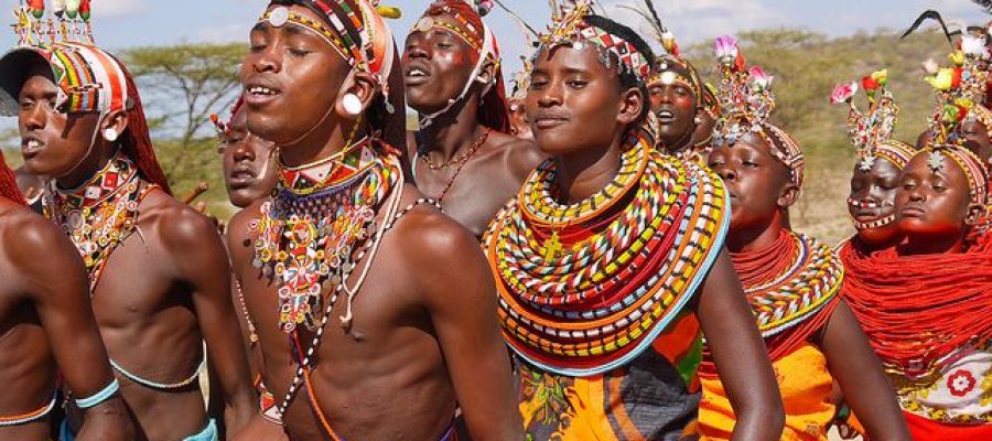 maasai-cultural Maasai warrior dancing during village tour clothes and headdresses